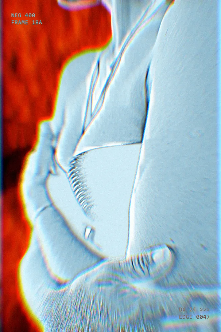 Thermal Negative look on a woman holding her arm, Prism splitting the edges into colour